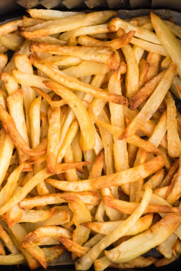 Reheated fries in air fryer basket. Ready to serve.