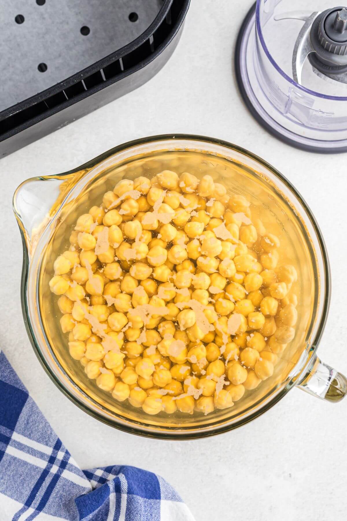Chickpeas being soaked in water.
