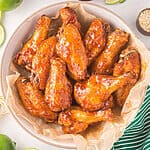 Reheated chicken wings in the air fryer and served in a bowl.