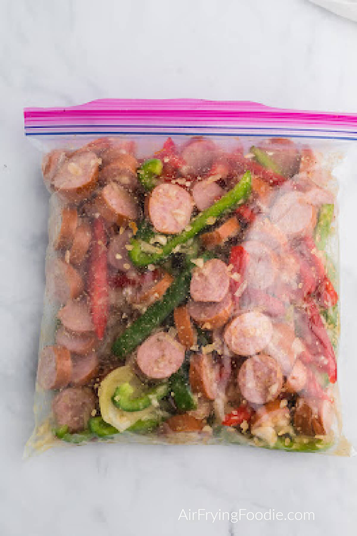 Ingredients tossed and coated in a sealable bag and ready to cook.