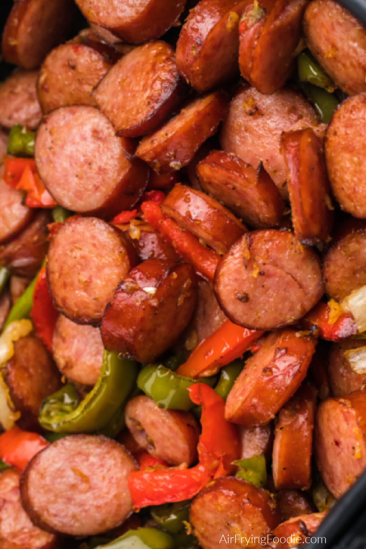 Close up photo of cooked air fryer sausage and peppers. 