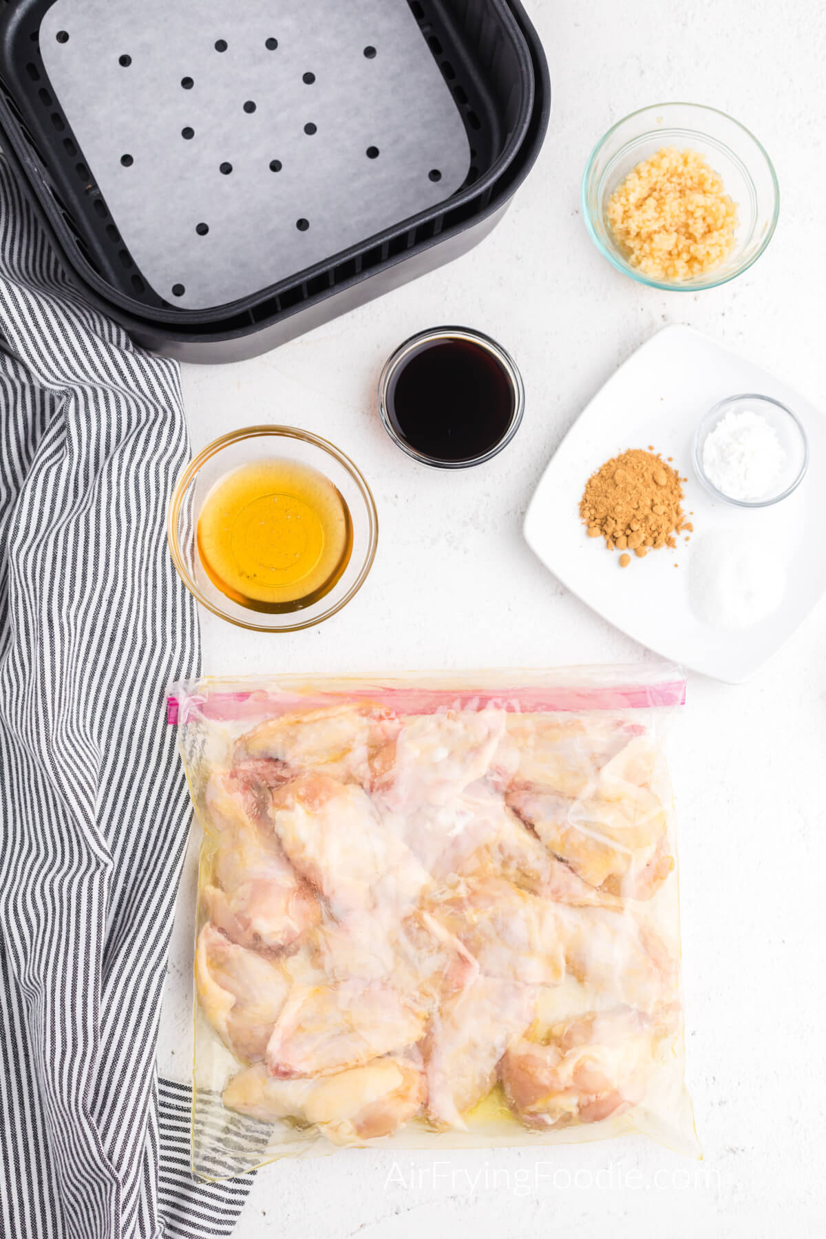 Chicken wings in a bag with olive oil. 