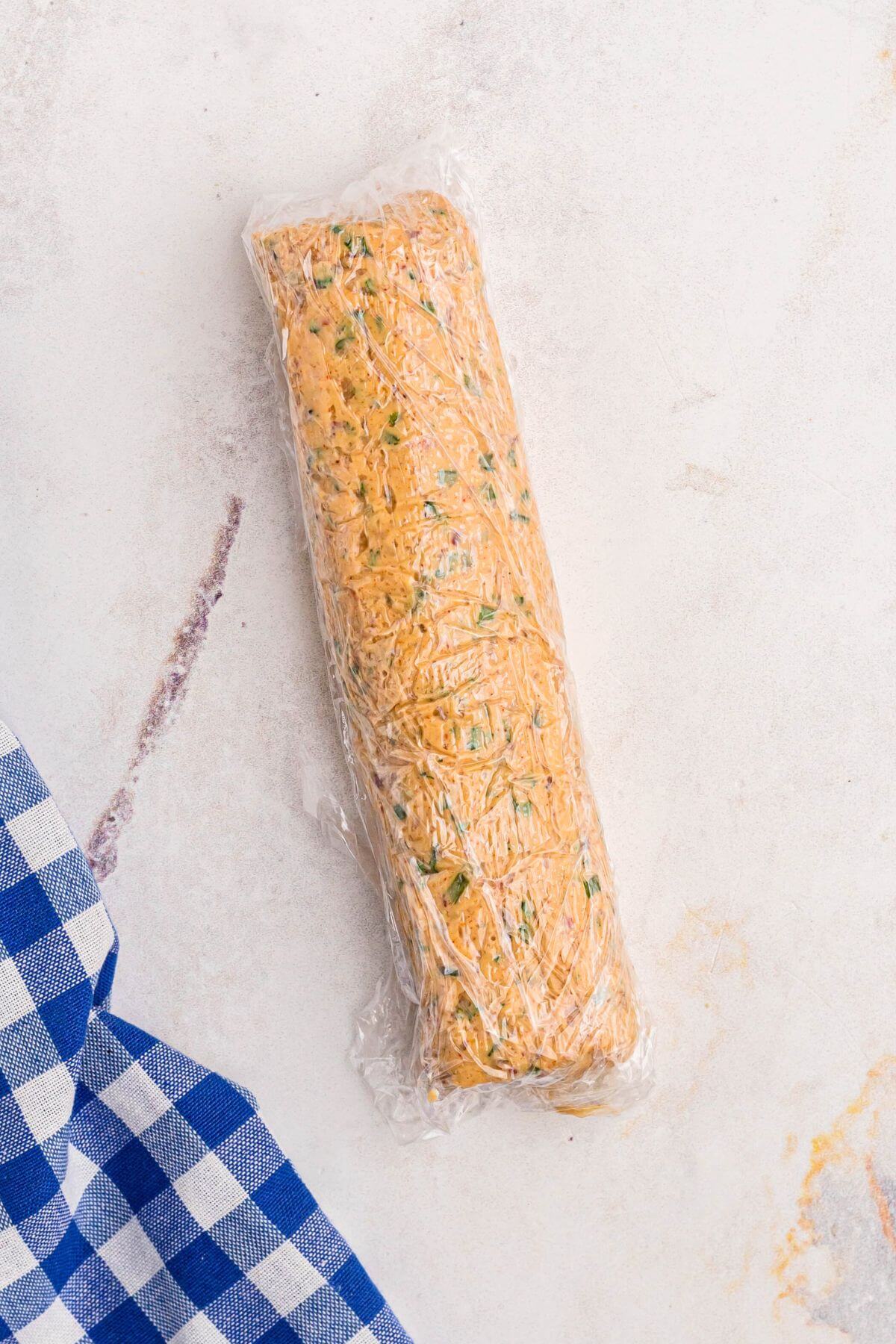 Cowboy butter rolled into a log and wrapped in plastic wrap before chilling. 