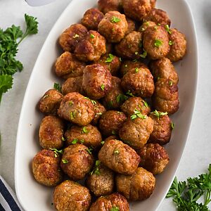 Golden juicy frozen meatballs after being cooked in the air fryer.