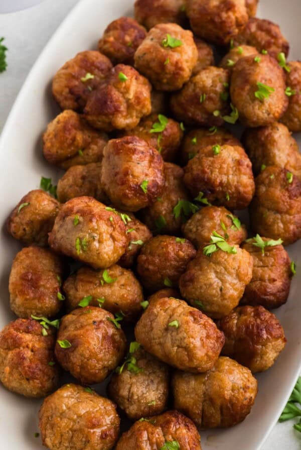 Golden juicy frozen meatballs after being cooked in the air fryer.