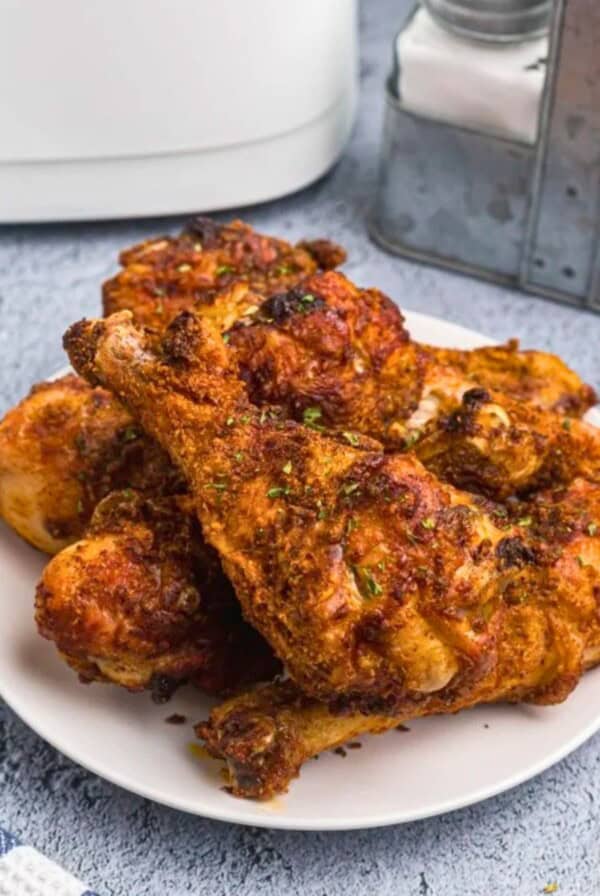uicy crusted chicken with seasonings served on a white plate