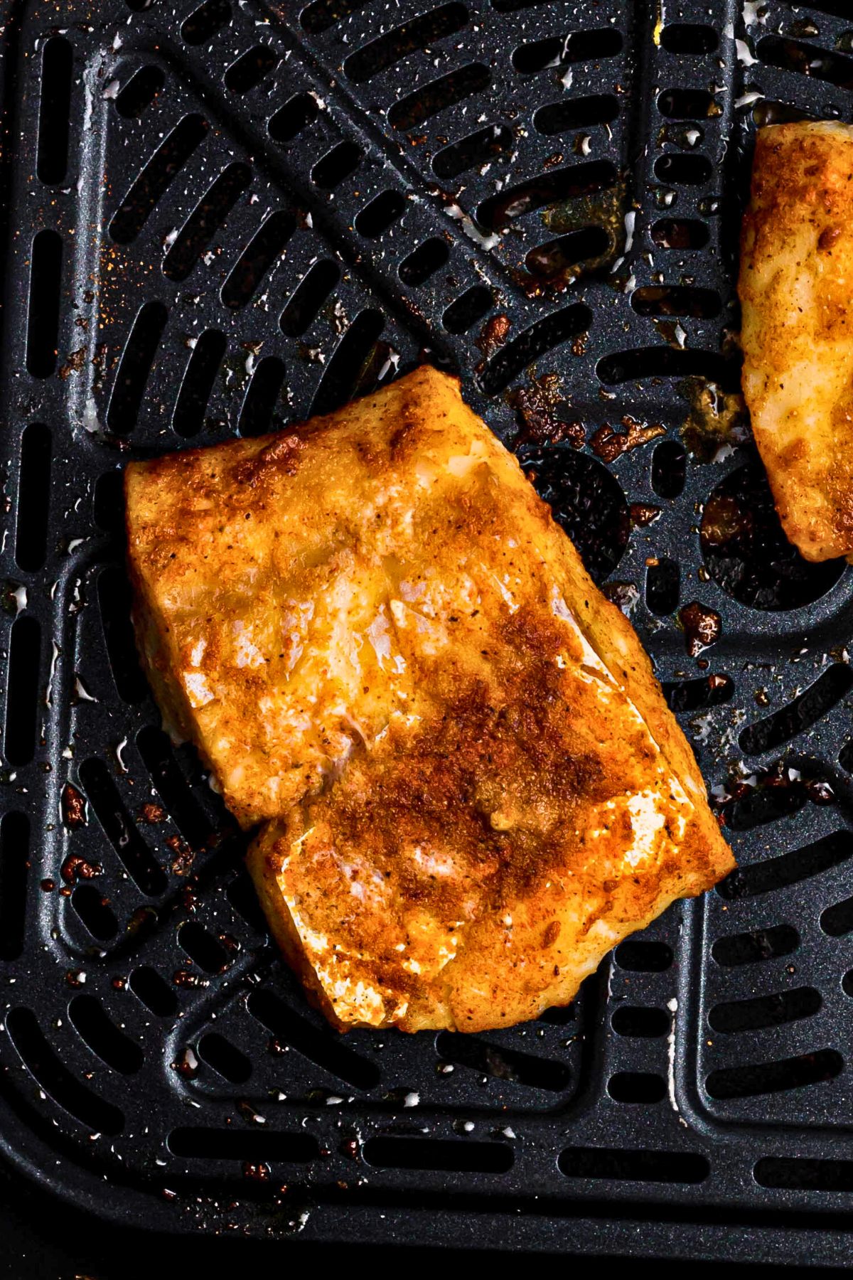 Juicy, moist cod filets after they are seasoned and air fried. 