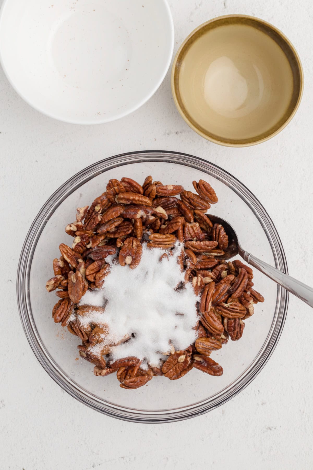 Cinnamon and sugar added to the pecans mixture. 