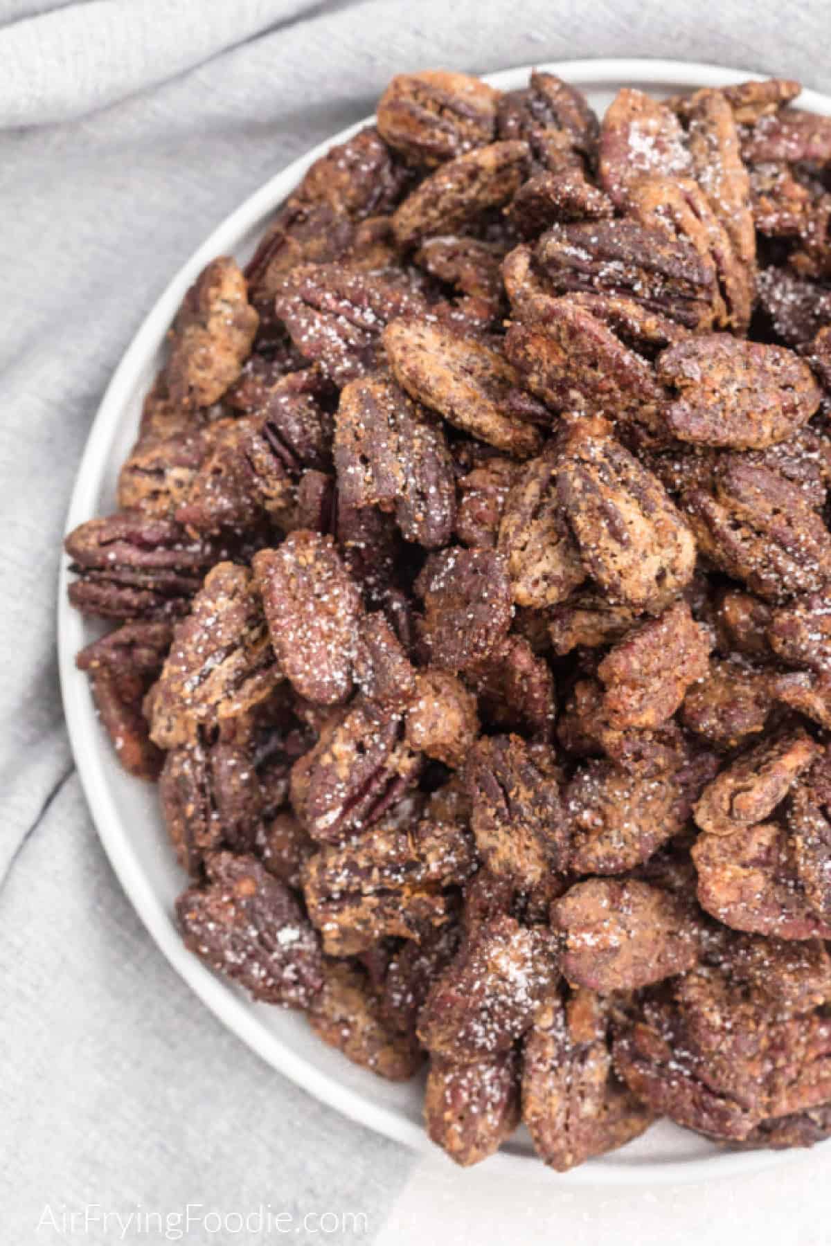 Bowl of candied pecans made in the air fryer. 