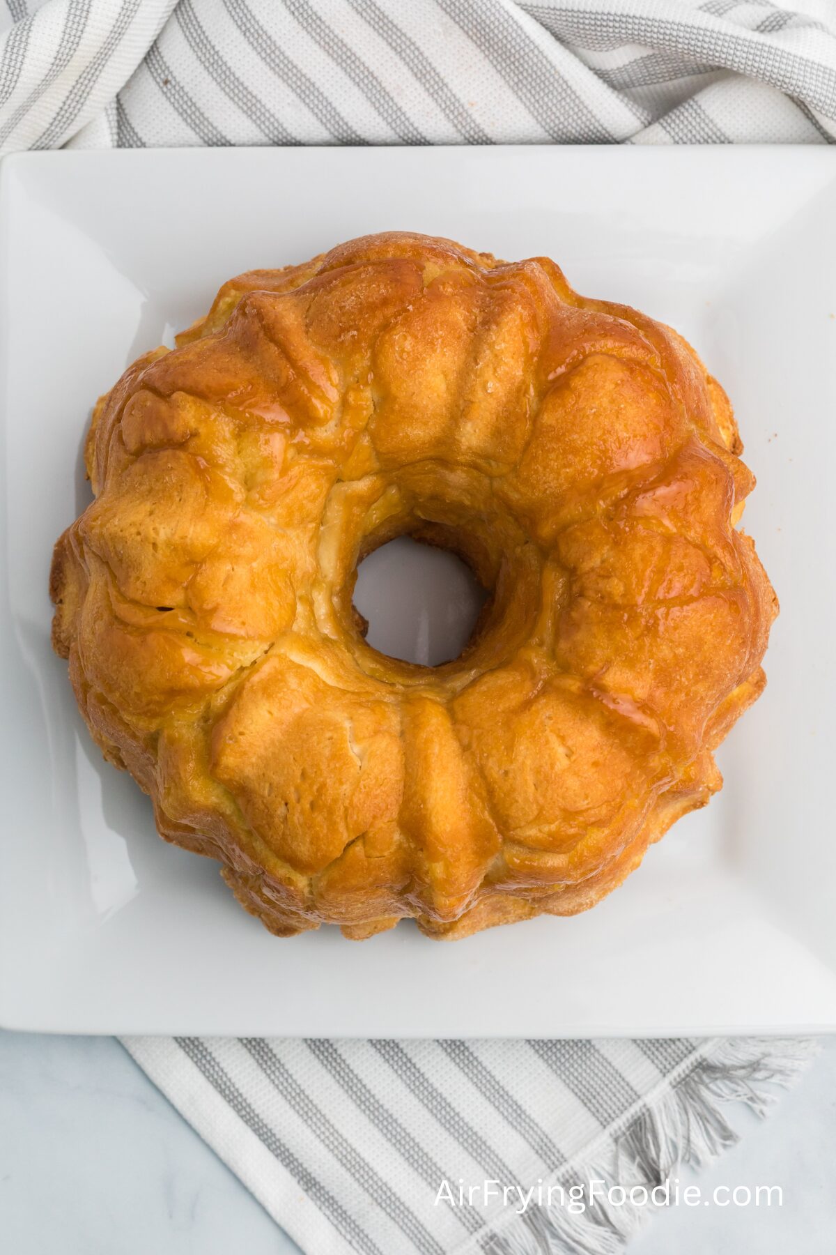 Monkey bread fresh out of the air fryer, ready to be topped with a glaze. 