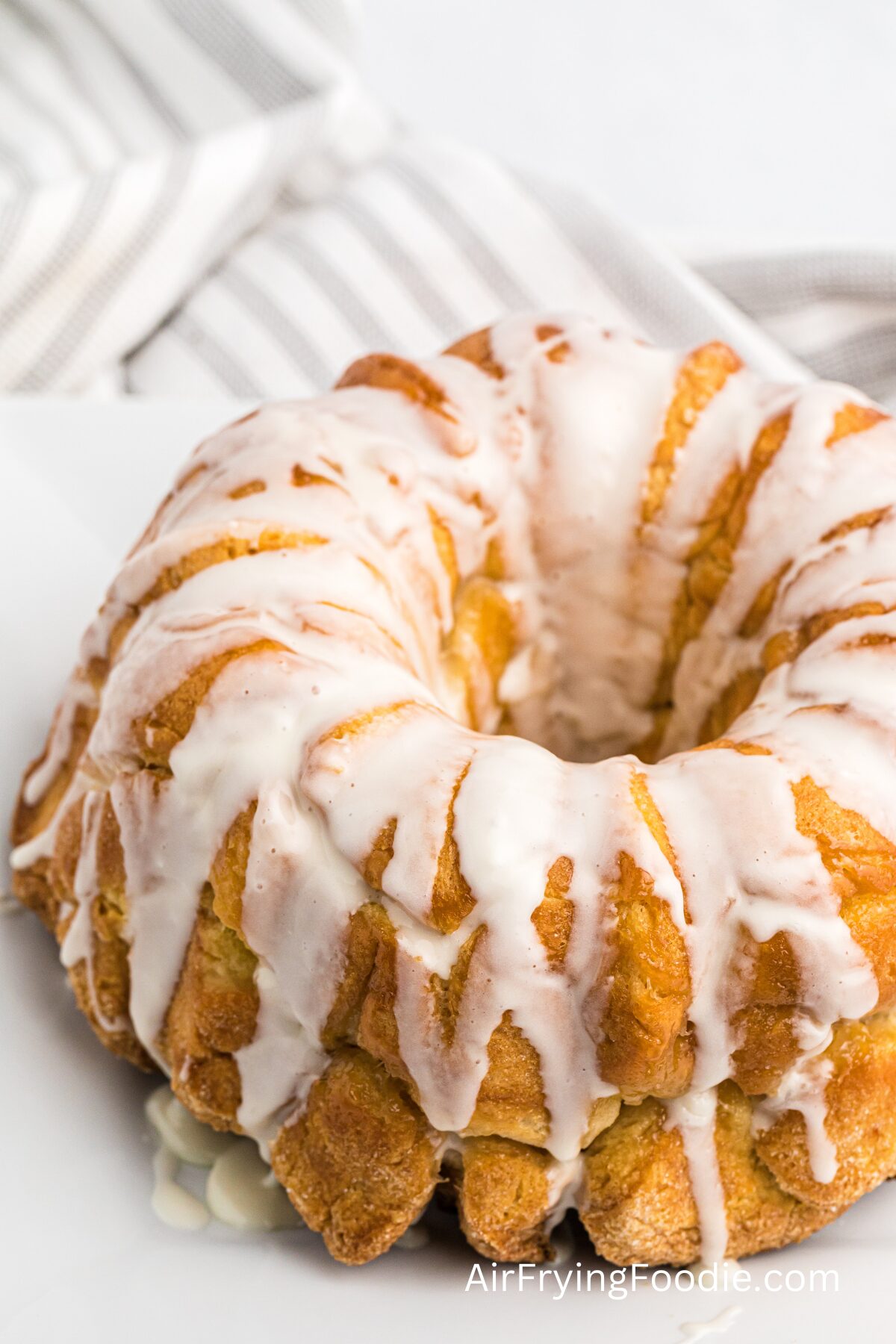 Monkey bread drizzled with glaze, ready to eat. 