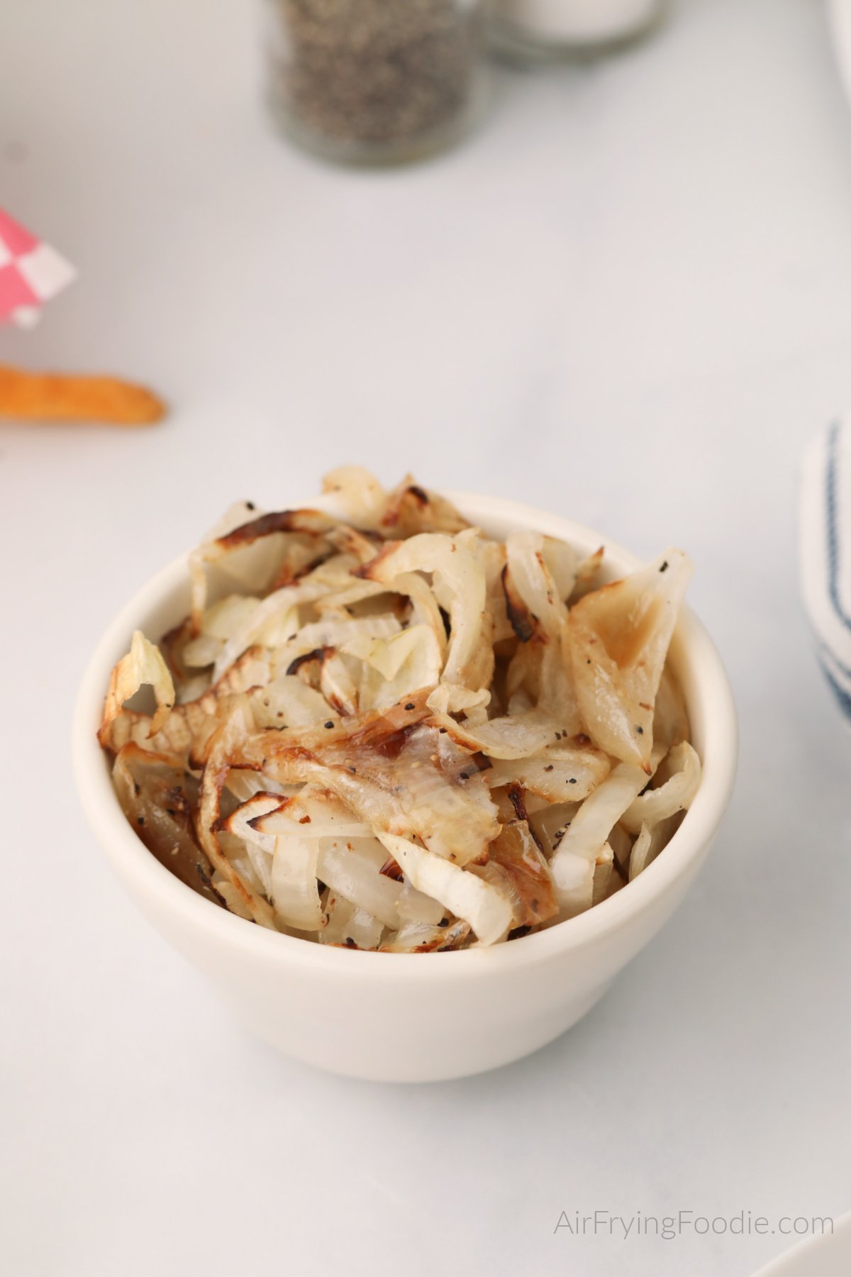 Crispy air fried onions in a bowl, ready to serve. 