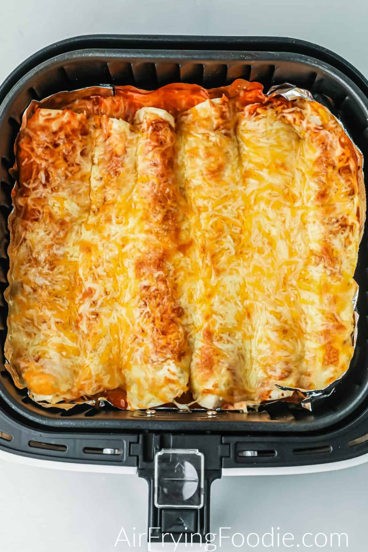 Cheesy enchiladas in the air fryer ready to serve. 