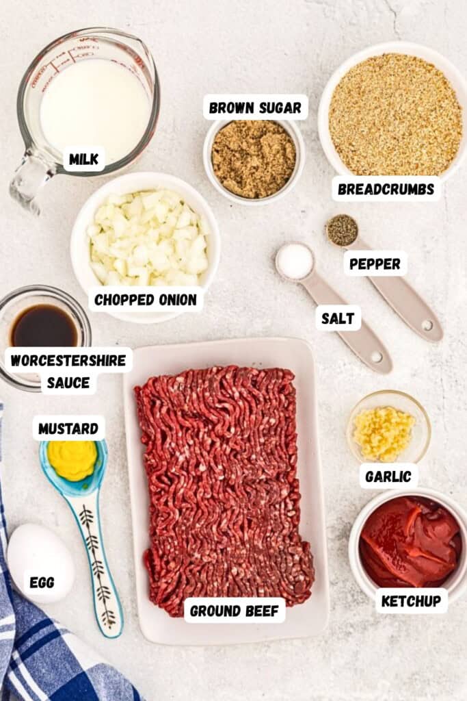 Ingredients measured into bowls and spoons on a white marble table