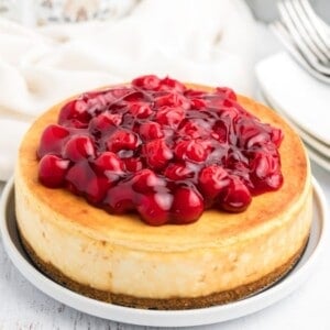 Air fryer cheesecake topped with cherries and ready to serve.