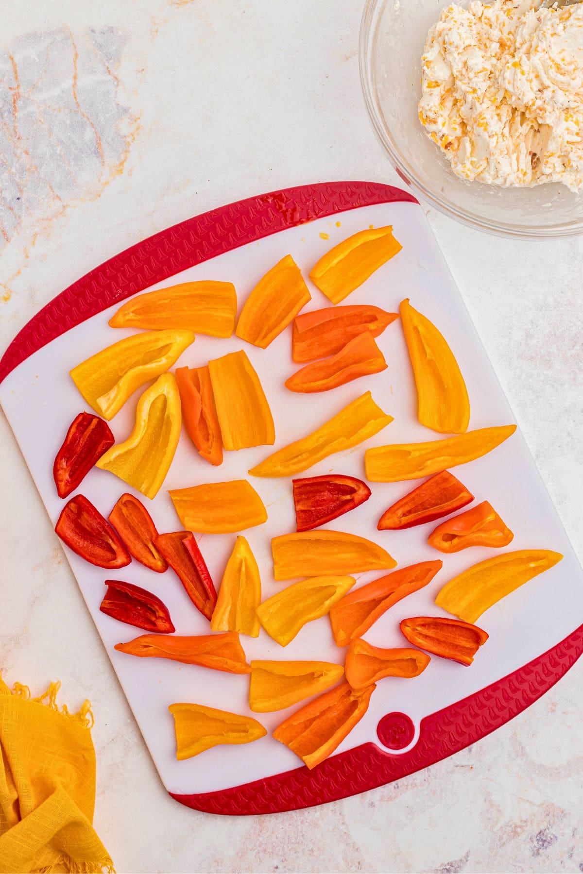 Mini peppers sliced in half with membranes and seeds removed. 