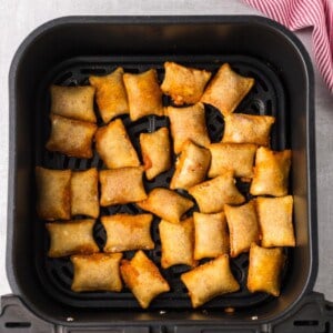 Air fryer pizza rolls cooked in the air fryer basket.