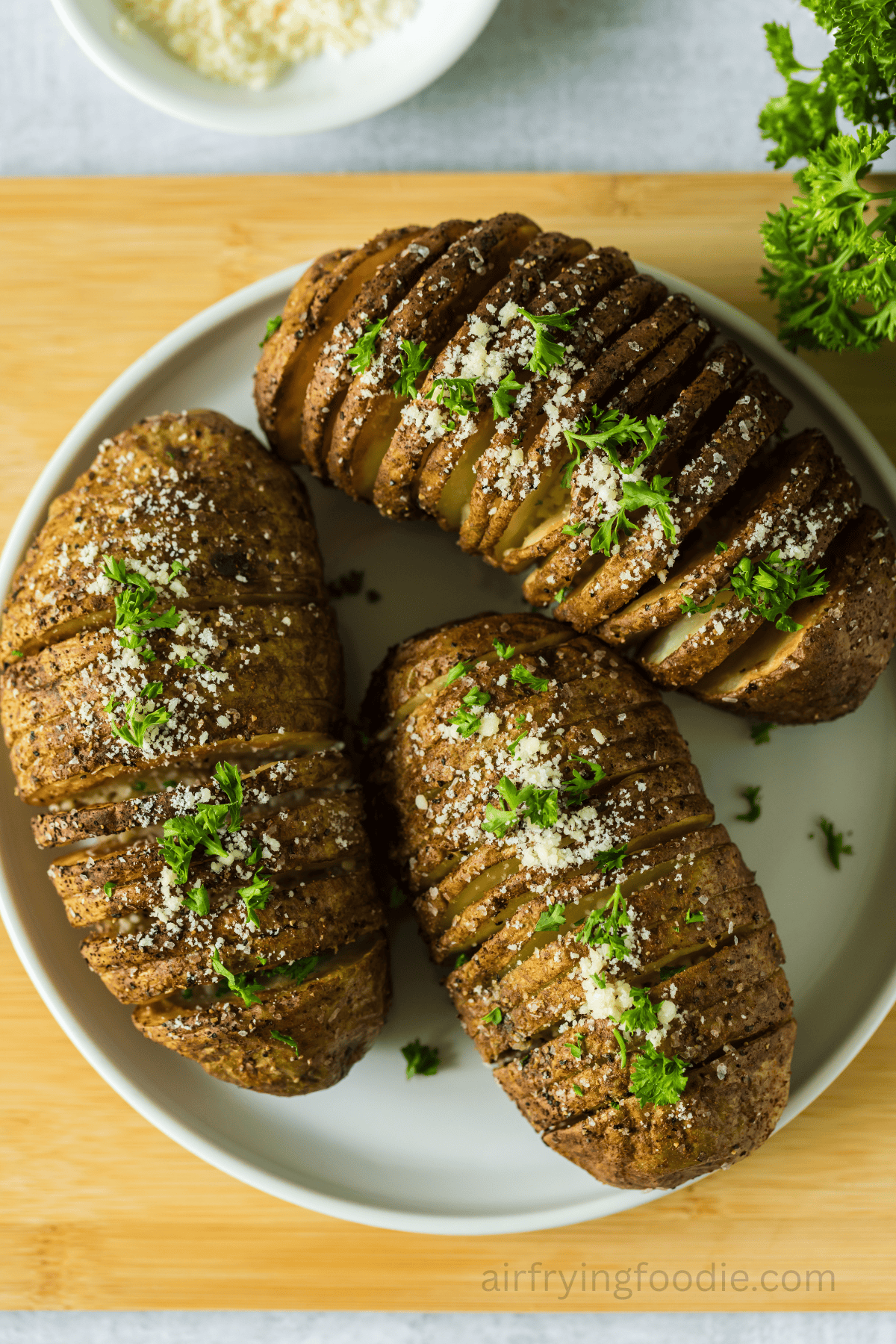 Air fryer Hasselback potatoes on a plate. 