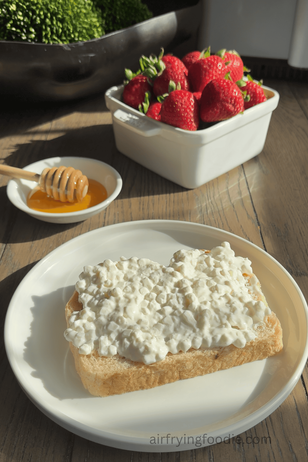 Cottage cheese on top of the sourdough bread.