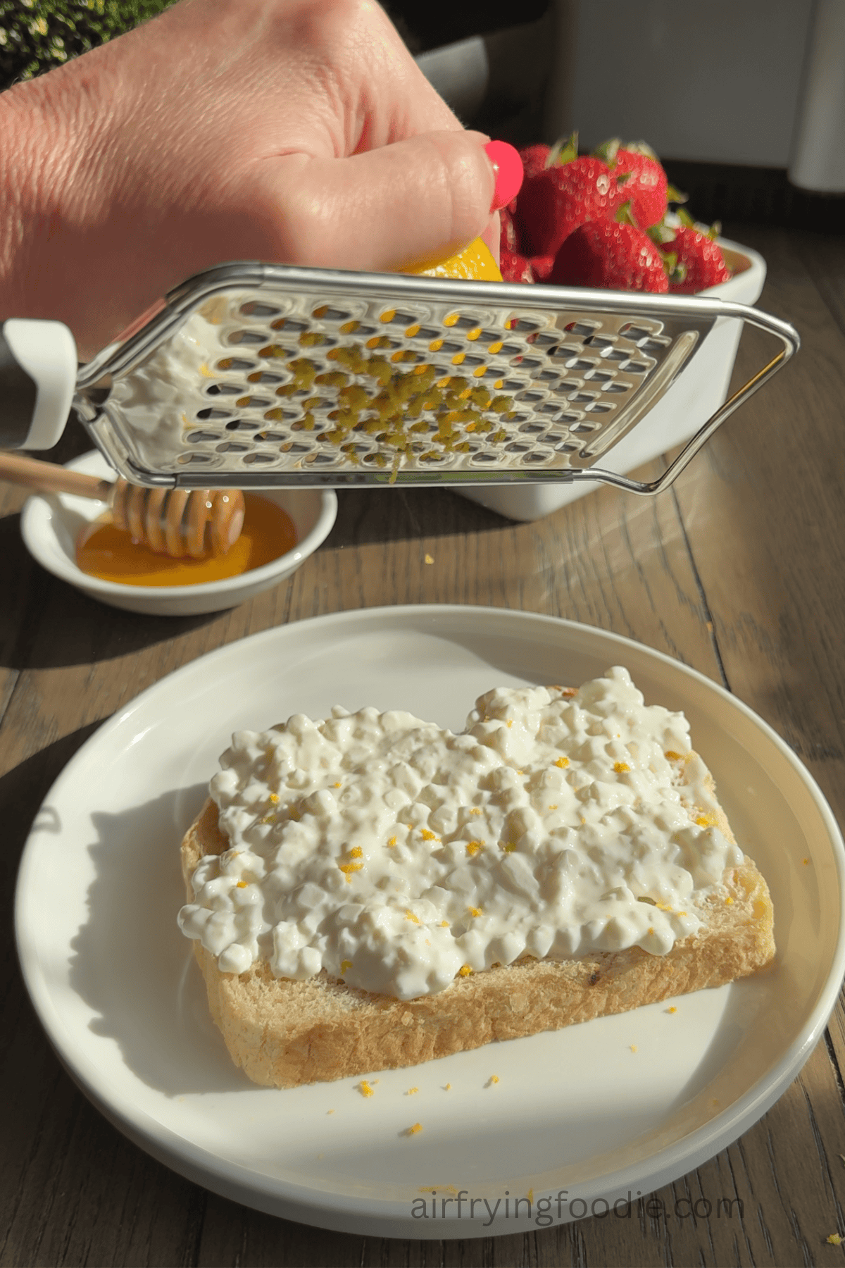 Lemon zest onto the cottage cheese.