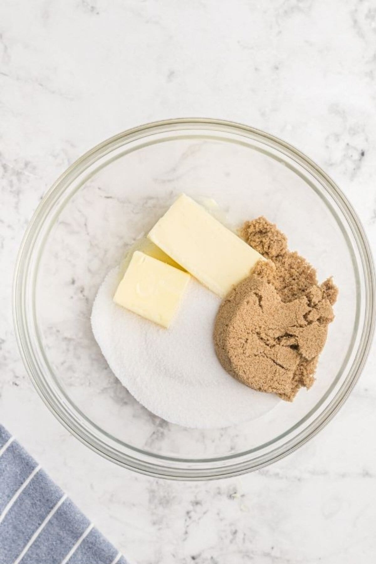 Butter and both types of sugar in a mixing bowl.